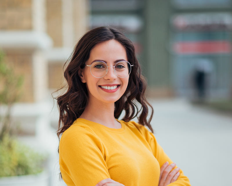 Woman wearing Invisalign® clear aligners at Greater Indianapolis orthodontists