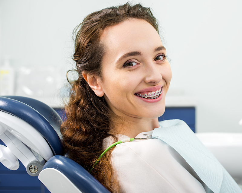 Patient with metal braces Carmel IN orthodontists