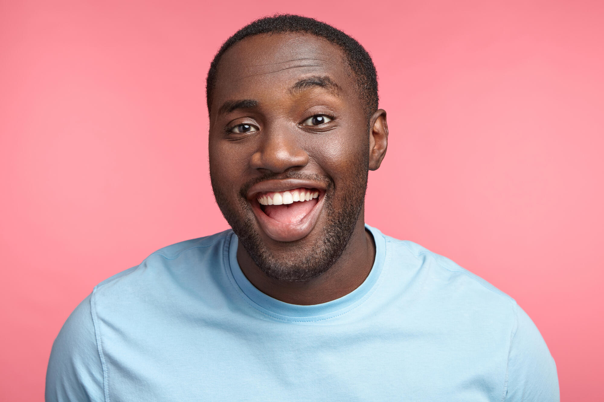 Happy,dark,skinned,fat,man,laughs,at,good,joke,,has